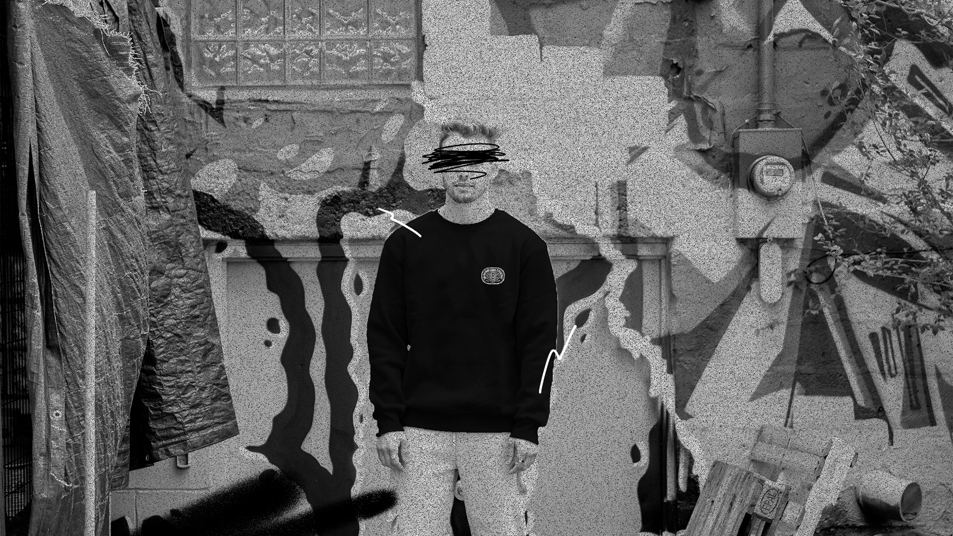 Man wearing a black crewneck sweatshirt by Uncommon Minds Collective (UMC). Sleek and minimalist streetwear style for a modern look. Shop UMC for premium black crewnecks and versatile fashion essentials.