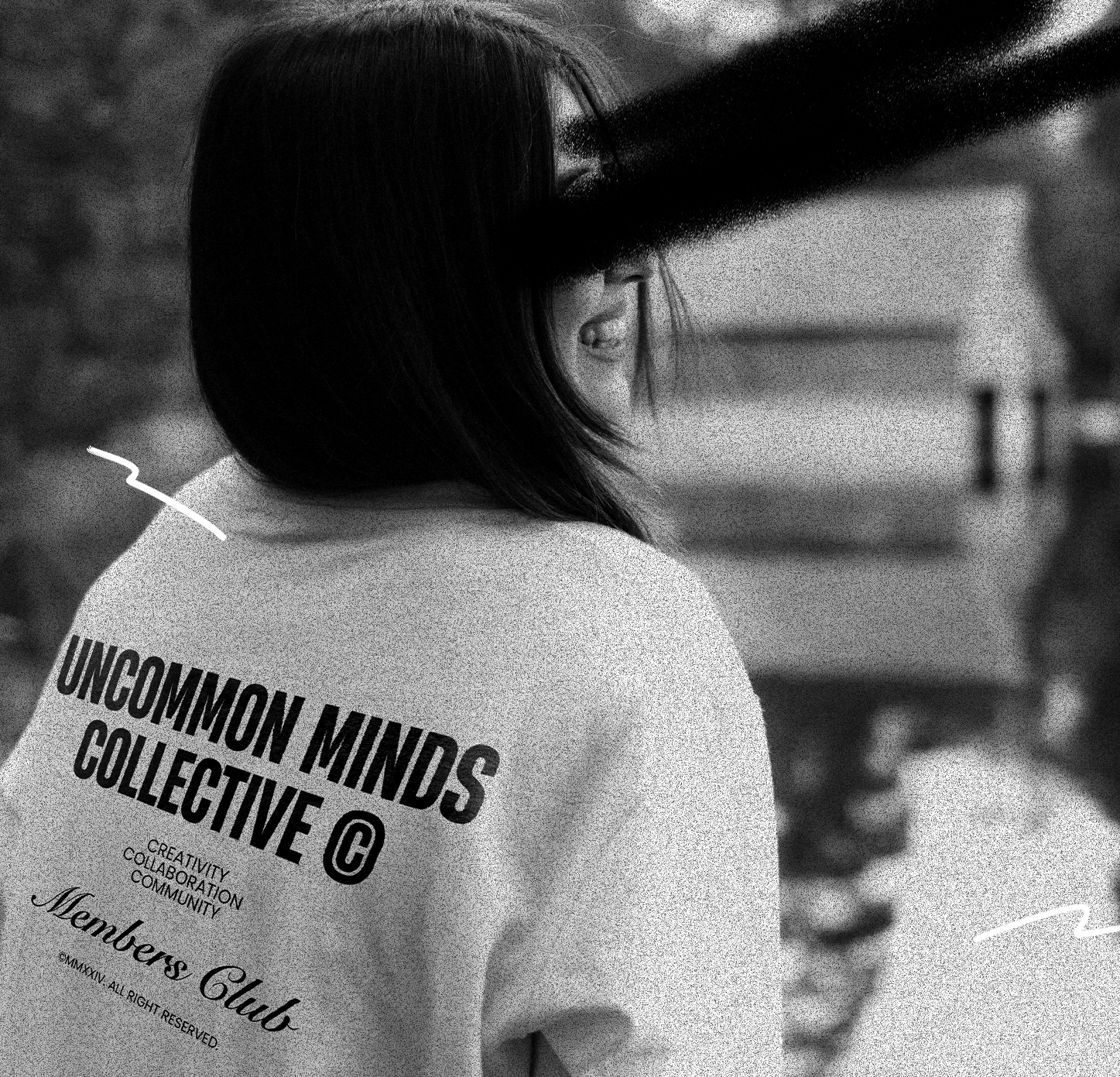 Laughing woman wearing a white t-shirt by Uncommon Minds Collective (UMC). Casual and comfortable streetwear for women, featuring minimalist design and trendy style. Shop UMC for relaxed fashion essentials.