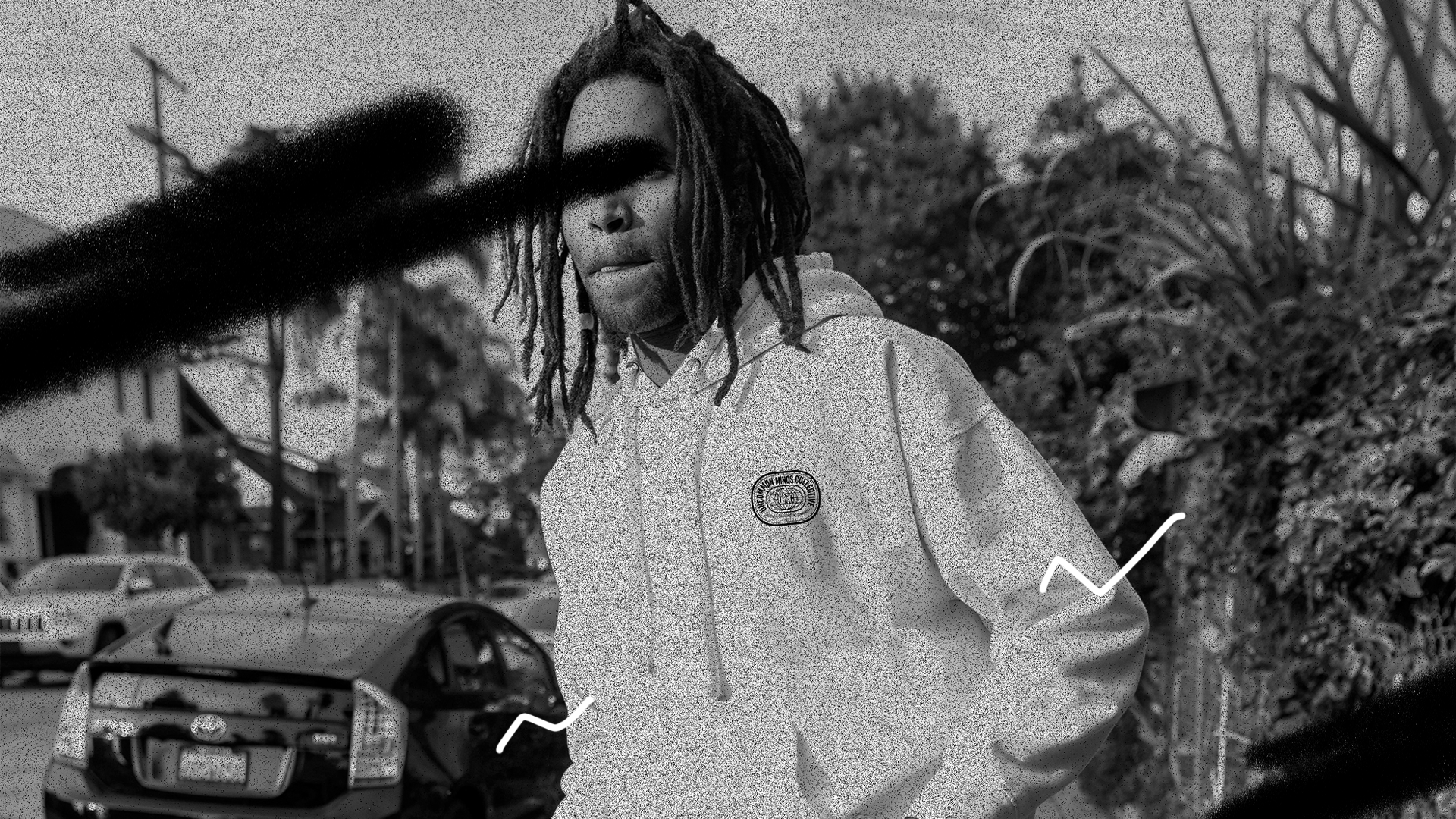 Man wearing a white hoodie by Uncommon Minds Collective (UMC). Clean and stylish streetwear with a minimalist design. Shop UMC for comfortable and trendy white hoodies.